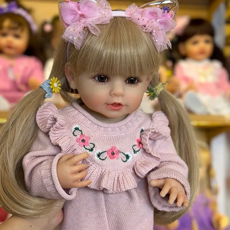 NPK 55 см Полностью силиконовая кукла Reborn Smile Baby Doll Дети для девочек Реалистичные светлые волосы Мягкие на ощупь Высококачественные кукольные подарки